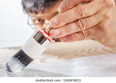 Applying White Primer Paint On Wood