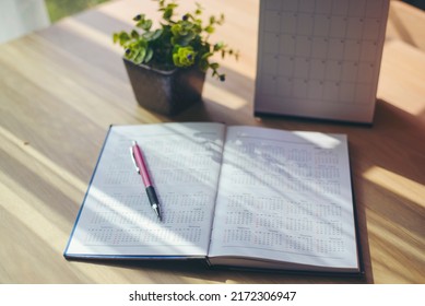 Appointment Calendar Concept.Desktop Calender, Diary Place On Office Desk, Working At Home. Notebook For Planner Plan Timetable, Agenda, Appointment Management Each Date, Month, And Year.