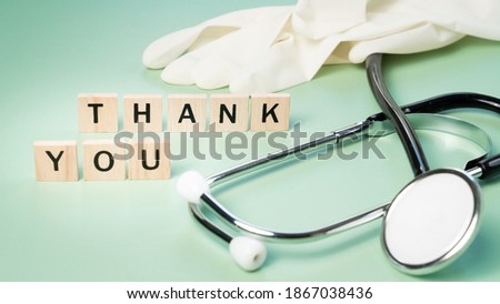 Appreciation and thankfulness to doctors, nurses and frontline healthcare workers concept. Beautiful wooden words puzzle arranging to 