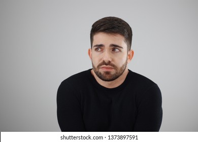 apprehensive and distrustful man looking at the fearful, distressed and agonized side - whit space for caption or text - Shutterstock ID 1373897591
