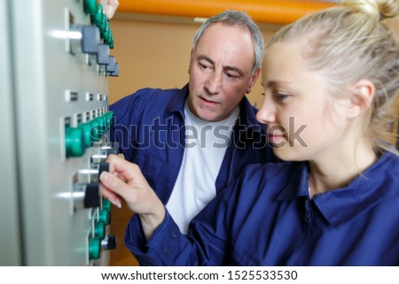 apprentice adjusting industrial button knob