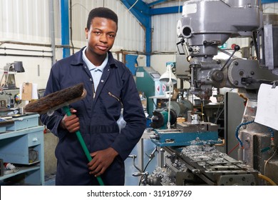 Apprentice In Engineering Factory Sweeping Floor