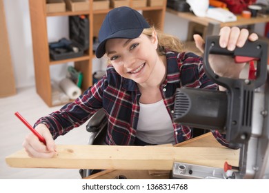 apprentice female carpenter who is wheelchair bound