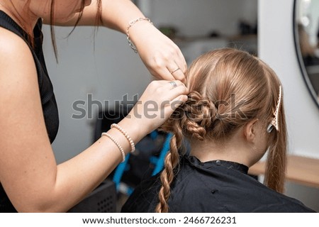 Similar – Image, Stock Photo Hair style, hairdresser, beauty and customer service concept. Cropped shot of barber man hands hold professional stylish gold hairbrush and scissors by the workplace, leather black chair in barbershop