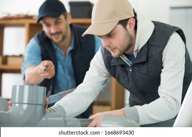 Apprentice Plumber Connecting Water Fittings