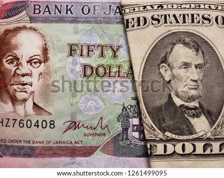 approach to jamaican banknote of fifty dollars and american banknote of five dollars, background and texture 