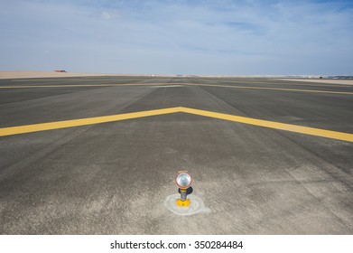 Approach Light At The Start Of An Airport Tarmac Runway With Chevrons