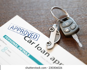 Approved car loan application and car keys