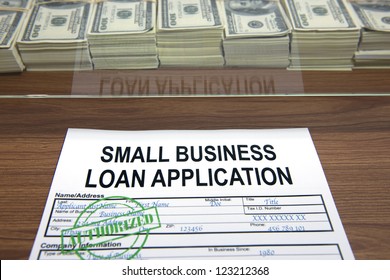 Approved Small Business Loan Application And Dollar Bills