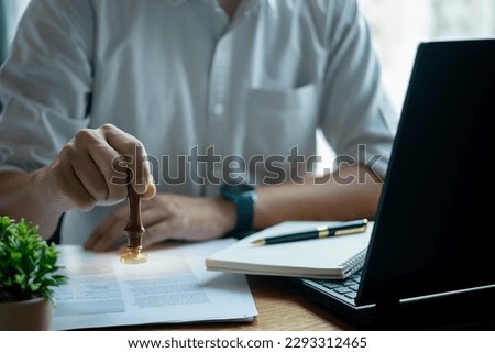 Approved stamp certificate document, symbolizing success and accomplishment. Contract law or paper work business and finance document rubber stamp. investment contracts, real estate documents.