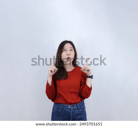 Similar – Image, Stock Photo Young happy woman appying make up in front of a round mirror