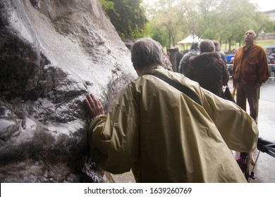 Apr 28. 2014 Lourdes France A faithful touch on the Massabielle Cave's wall where the Virgin Mary appeared to a girl named Bernadette Soubirous. A place of pilgrimage is known for its healing power.