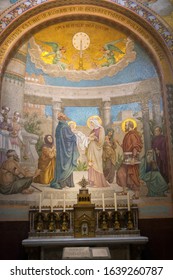 Apr 28. 2014 Lourdes France A light to enlighten the Gentiles. Monumental mosaic murals adorn the interior of Rosary Basilica.