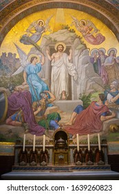 Apr 28. 2014 Lourdes France I am in resurrection and life. Monumental mosaic murals adorn the interior of Rosary Basilica.