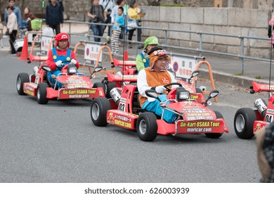 Apr 6 2017, Osaka Japan:- Tourist Dress Up Super Hero, Cartoon Cosplay And Drive Go Kart In Osaka, Japan. Famous Street Go-Kart Osaka Tour.