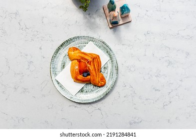 Apricot Bag On A Plate At A Local Bakery.