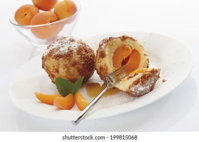 Apricot Dumpling Breaded, Served On Plate,in The Background Bowl Filled With Apricots