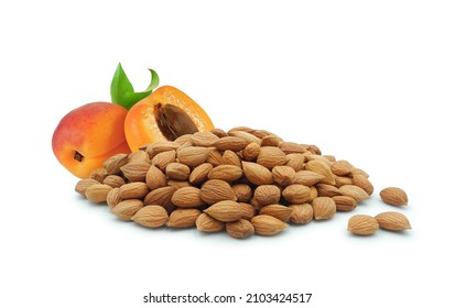 Apricot kernels and juicy fruit isolated on white background