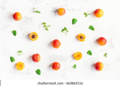 Apricot on white wooden background. Sliced apricot top view, flat lay - Powered by Shutterstock