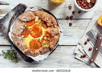 Apricot Wholegrain Galette With Cream Cheese Filling And Roasted Almond. Fruit Tart. Overhead View