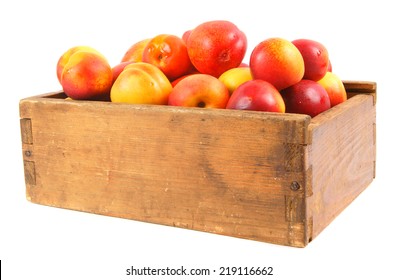 Apricots in an old box on a white background. - Shutterstock ID 219116662
