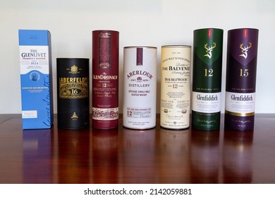 Brasília-Df,Brazil, April 03, 2022: Single malt whisky collection on rustic wooden table. 