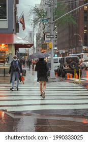 April 12, 2021 -  New York: Transgender Man Walking On Rainy Day In Manhattan, New Yorker, Back View. Street Photography Concept. Self Confidence