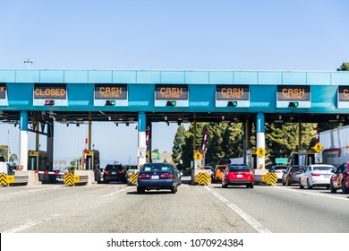 April 14, 2018 Vallejo / CA / USA - Cars stopping at Carquinez Bridge Toll Plaza to pay for the use of the bridge of eastbound traffic; north San Francisco bay area
