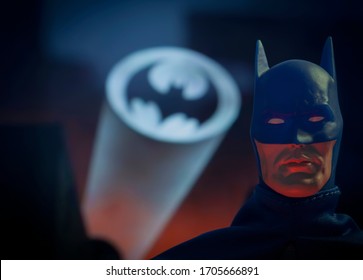 APRIL 15 2020:  Portrait of crime fighter Batman with the bat signal over Gotham City - Mego Corp. action figure