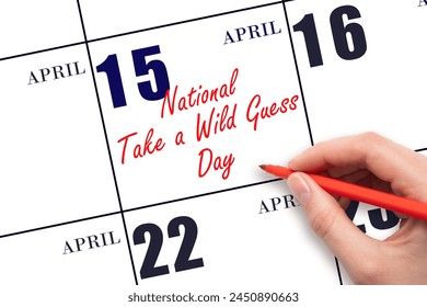 April 15. Hand writing text National Take a Wild Guess Day on calendar date. Save the date. Holiday. Important date. - Powered by Shutterstock