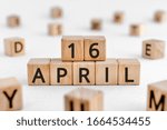 April 16 - from wooden blocks with letters, important date concept, white background random letters around