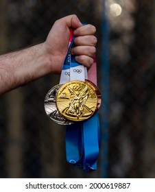 April 17, 2021 Tokyo, Japan. Gold, Silver And Bronze Medals Of The XXXII Summer Olympic Games In Tokyo In The Hand Of An Athlete.