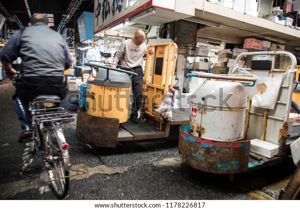 April 20, 2015 - Tokyo, Japan - Workers and\
merchants carrying fresh fish products in famous Tsukiji fish\
market with their gas powered\
vehicles