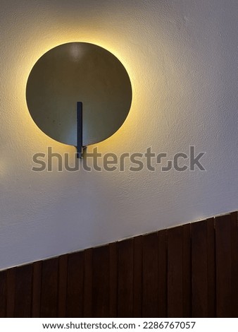 April, 2023. Bandung, West Java, Indonesia. Roung Shape Lamp with Dark Wooden Line Pattern