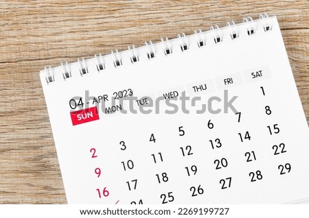 April 2023 desk calendar for 2023 on wooden background. Imagine de stoc © 