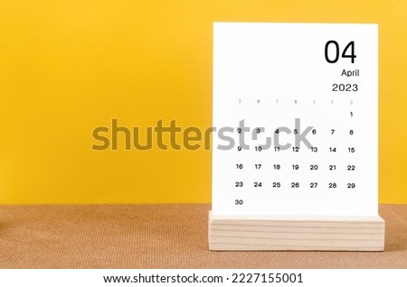 April 2023 Monthly calendar for 2023 year on yellow table. Imagine de stoc © 