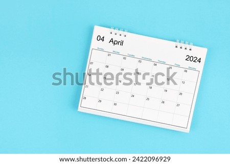 April 2024, Monthly desk calendar for 2024 year on blue color background.