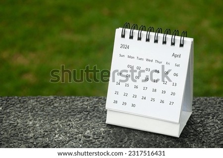 April 2024 table calendar with customizable space for text. Copy space and calendar concept
