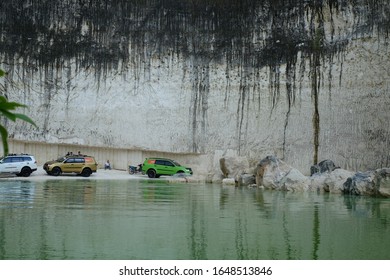 April 22, 2017, Madura, Indonesia. The Pajero Sports Car Passes Over A Limestone Hill With A Lake Edge