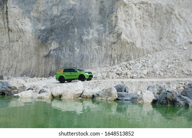 April 22, 2017, Madura, Indonesia. The Pajero Sports Car Passes Over A Limestone Hill With A Lake Edge