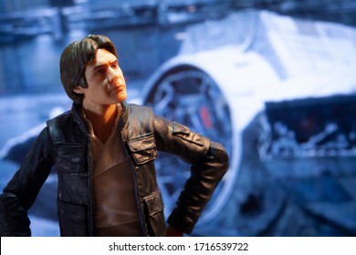 APRIL 27 2020: Recreation of a scene from Star Wars The Empire Strikes Back with Han Solo in a Rebel base hanger with the Mellenium Falcon - Hasbro action figure