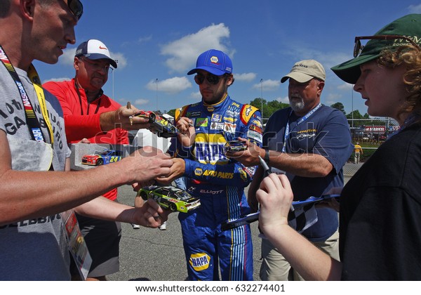 April 28, 2017 - Richmond, Virginia, USA: Chase\
Elliott (24) signs autographs for fans before practice for the\
Toyota Owners 400 at Richmond International Speedway in Richmond,\
Virginia.