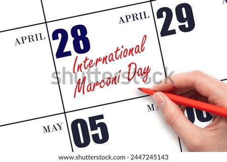 April 28. Hand writing text International Marconi Day on calendar date. Save the date. Holiday. Important date.
