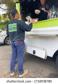 April 30 2020, Kirkland WA. A Man Is Buying Food From The Taco Truck.