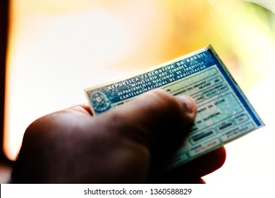 April 5, 2019, Brazil. Man holds National Driver's License (CNH). Official document of Brazil, which attests the ability of a citizen to drive land vehicles.