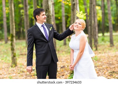 April Fools' Day. Wedding Couple Posing With Stick Lips, Mask.