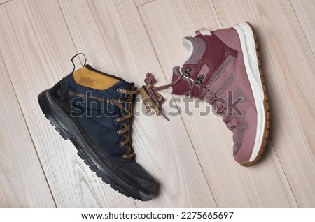 April Fool's Draw. Two different boots with tied laces