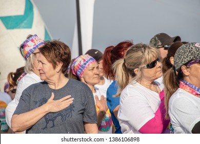 April ‎6 ‎2019 Tulsa USA People in line for Color run put hands over their hearts for National Anthem