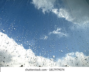 April Weather: Sun And Raindrops On The Window Pane