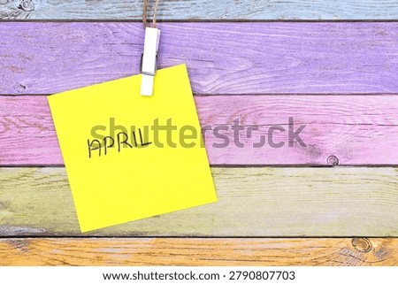 april write on card on rustical wooden background 